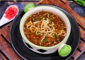 Warm Up with a Bowl of Spicy Manchow Soup: A Restaurant Favorite at Home